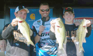 Hayden Bartee and Zeke Gossett hold up their winning bag of Lay Lake bass. Chris Mitchell photo